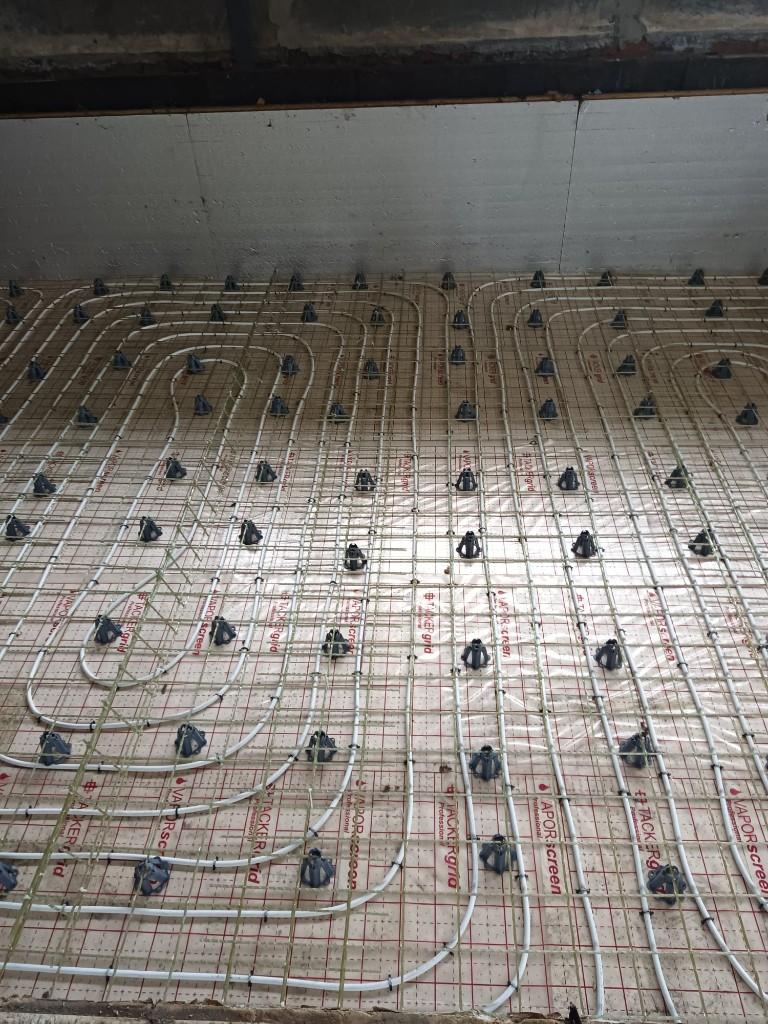 GFRP mesh and underfloor heating pipes before the screed is poured