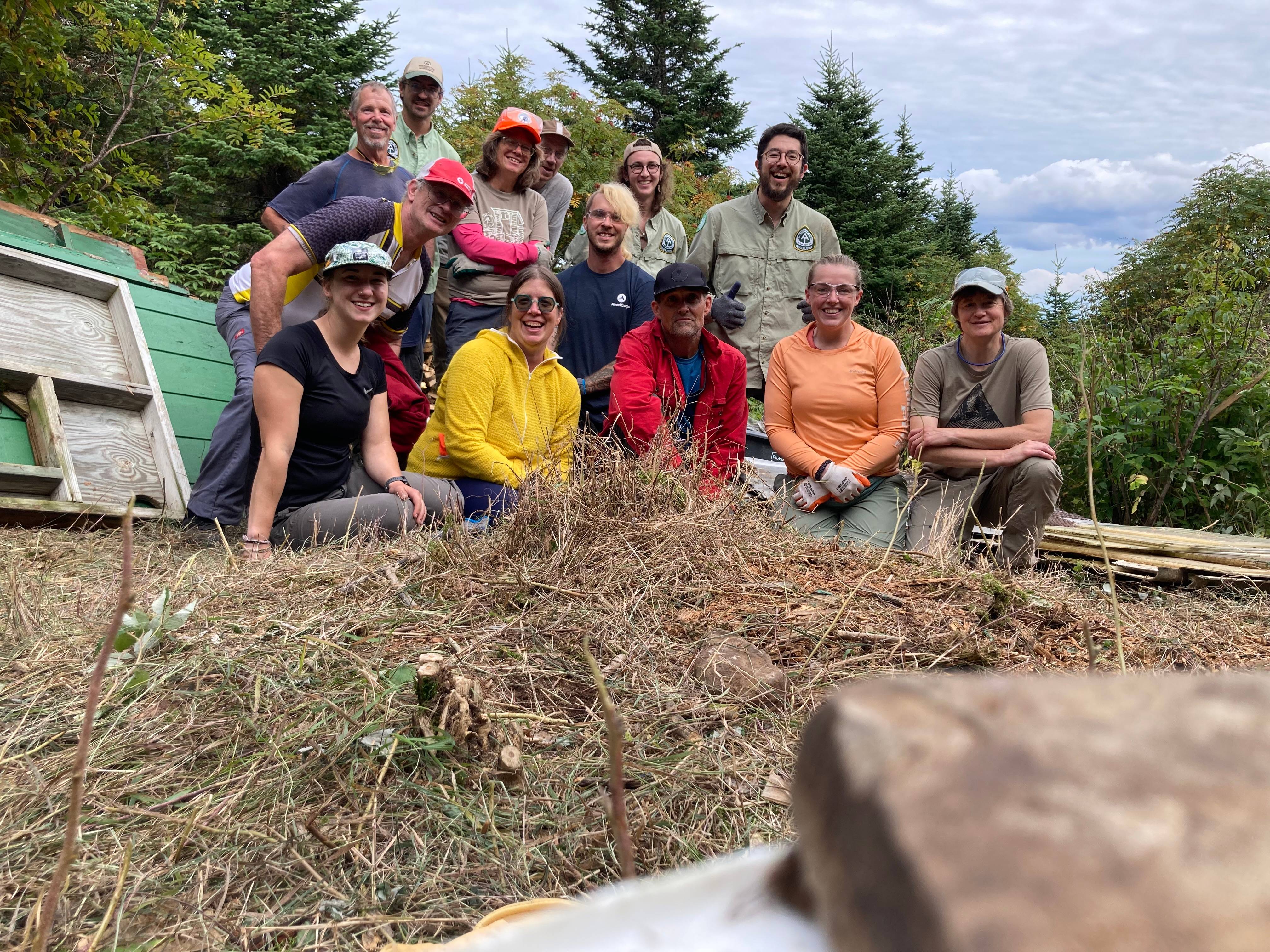 A group of volunteers celebrate their work at Horns Pond
