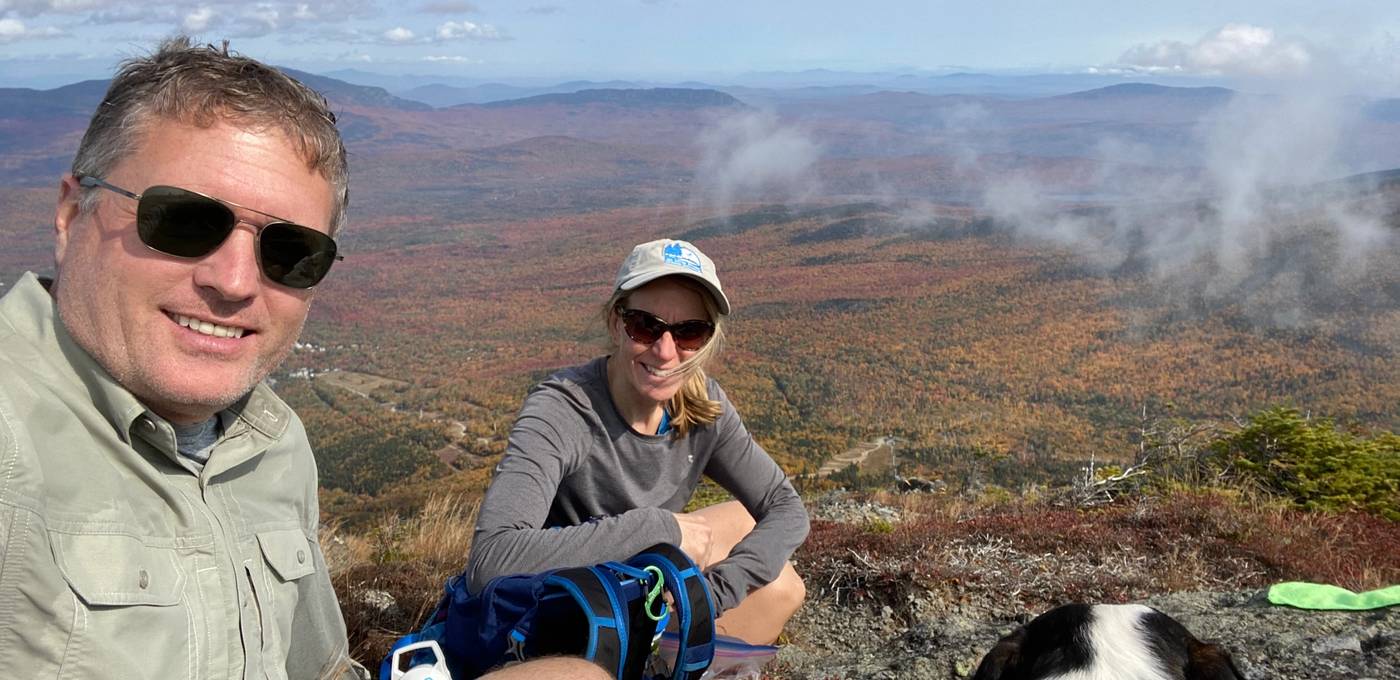 Fritz and Susan Onion stand on top of a mountain after a long hike.