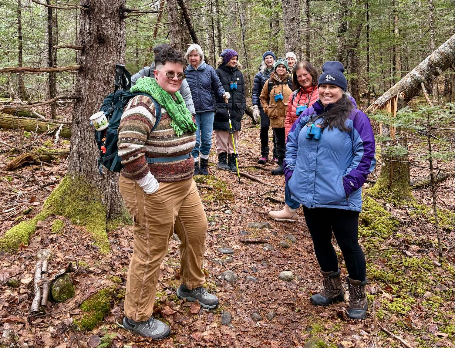 A group of outdoor hikers gathers in the wood for a Women for Healthy Rural Living program