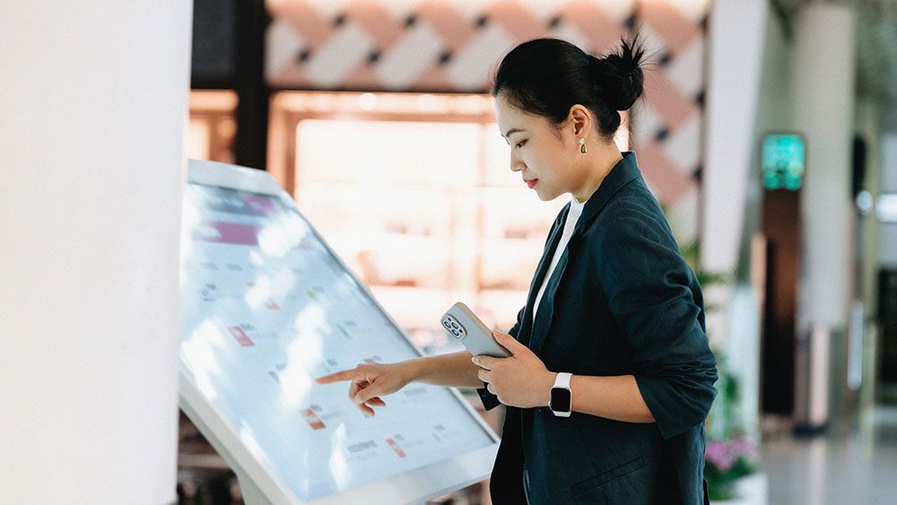 Interactive touchscreen kiosk used by a visitor for product exploration