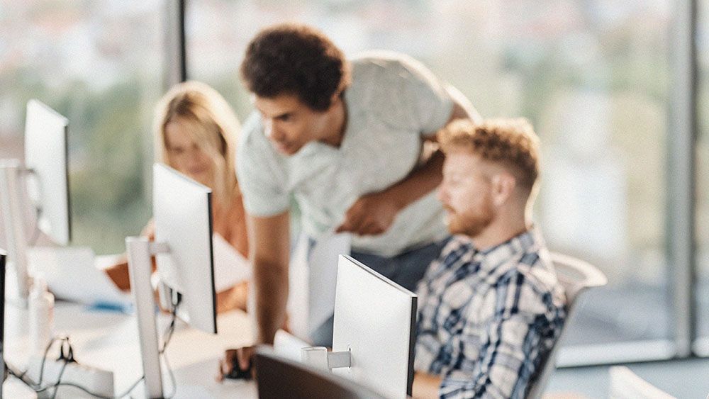 Operations team managing digital signage content and schedules remotely