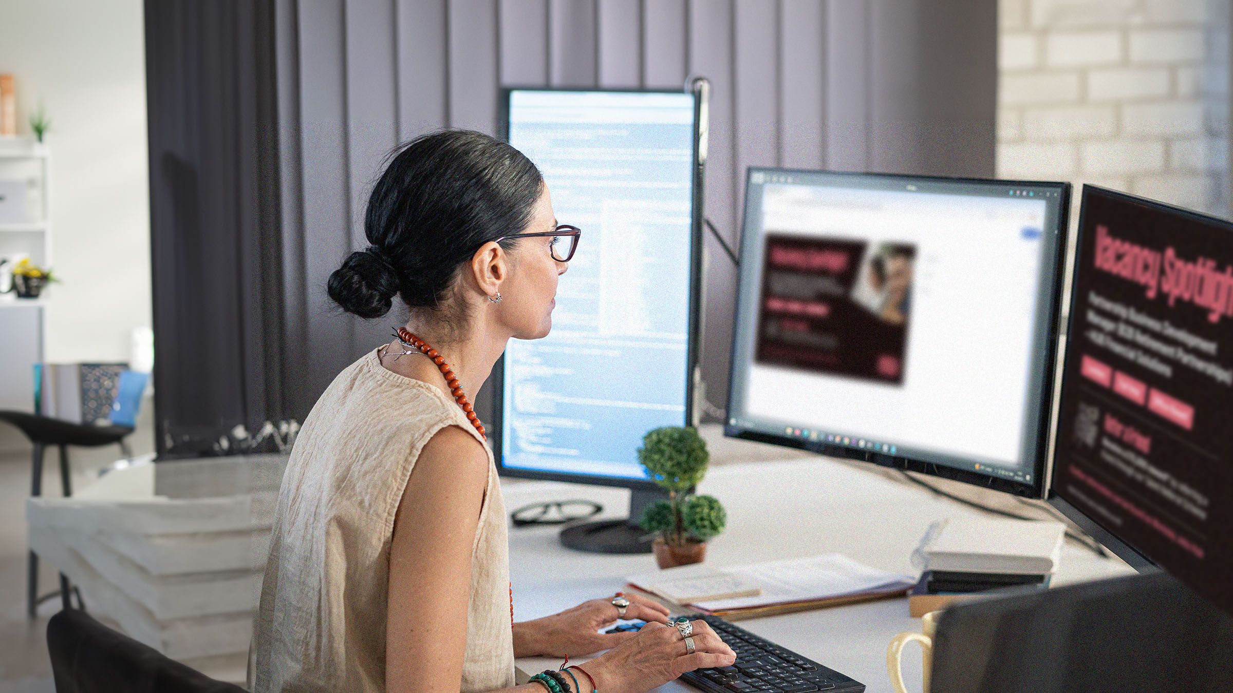 Designer and software developer creating custom digital signage app content