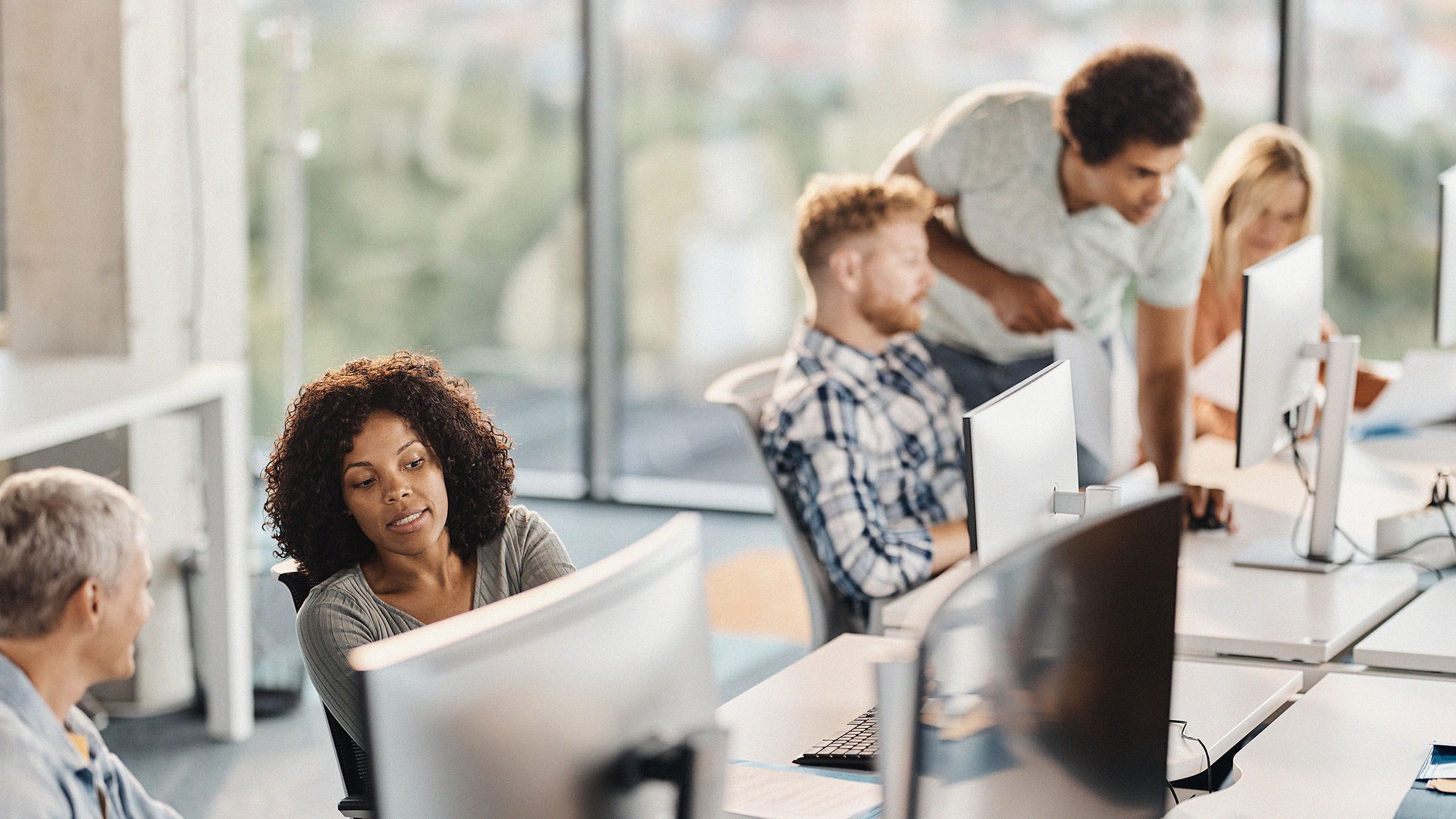 Team of people working at computers