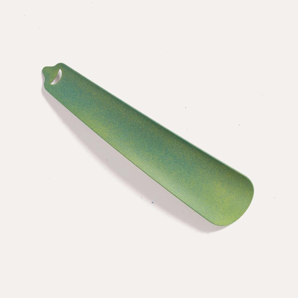 Thud Shoe Horn, by the door.