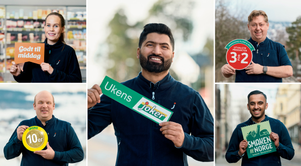 Ansatte viser frem Joker-kampanjeskilt