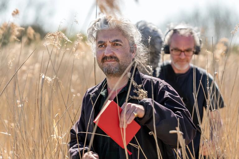 Image showing two men recording sound for the radio drama, in the midst of reeds in Norfolk