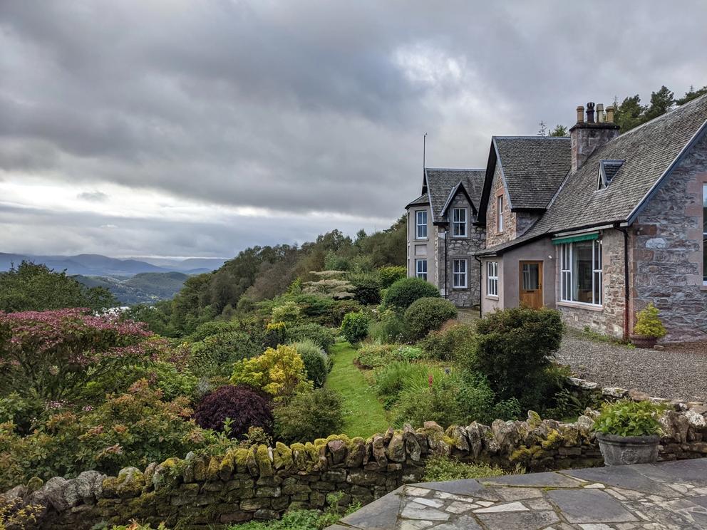 Images of stone houses set in a lush Highland landscape.