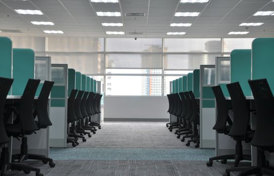 Empty office cubicles representing silent turnover and disengagement risks in workplace culture.