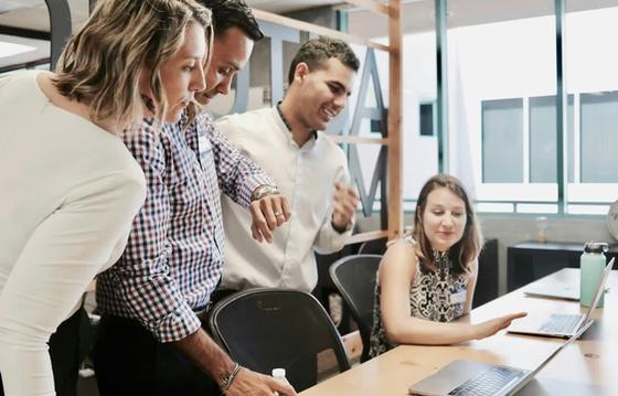 Team using employee engagement tools in a modern office.