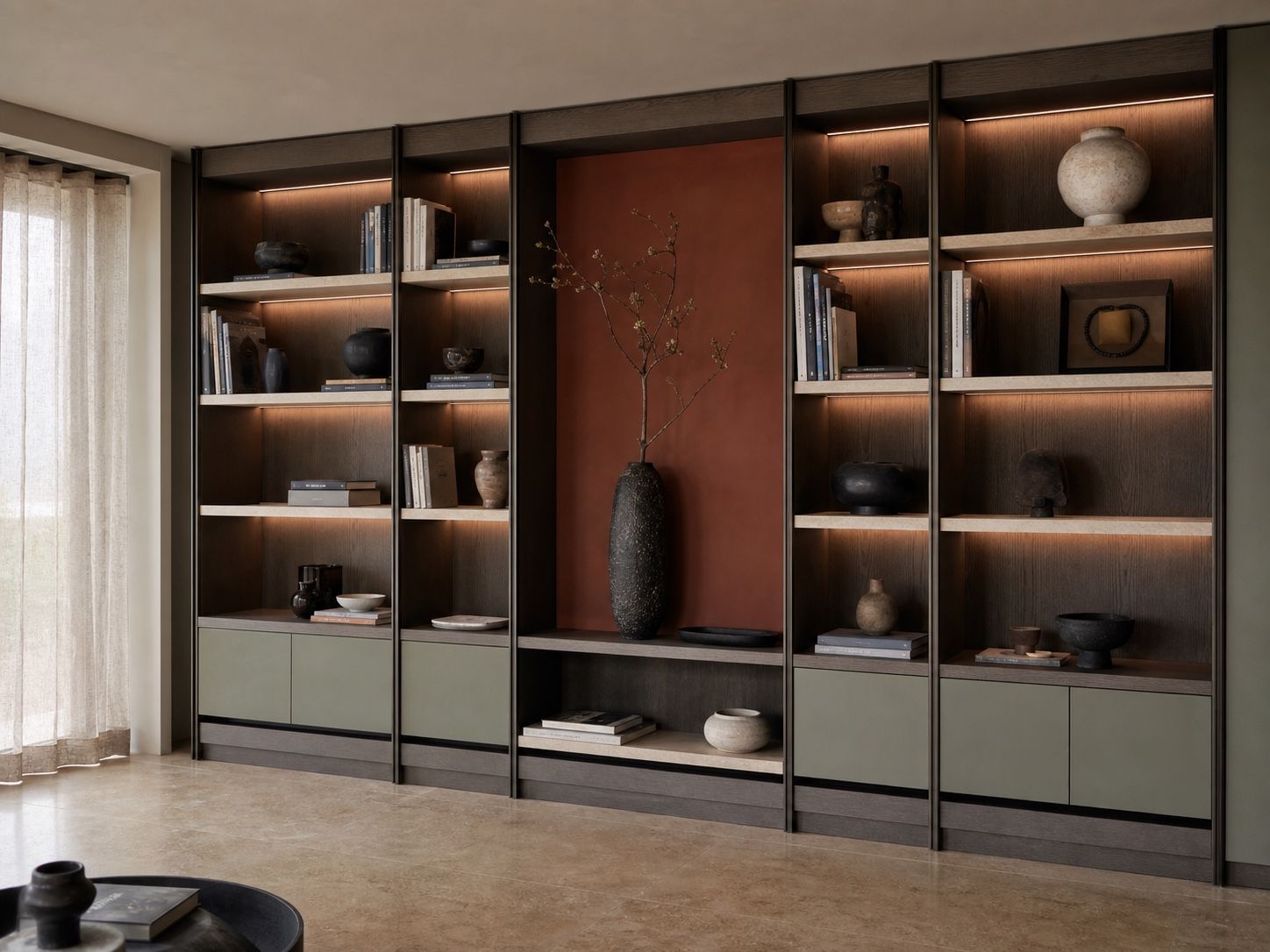 Floor-to-ceiling smoked oak library with terracotta niche, travertine shelves, and concealed storage