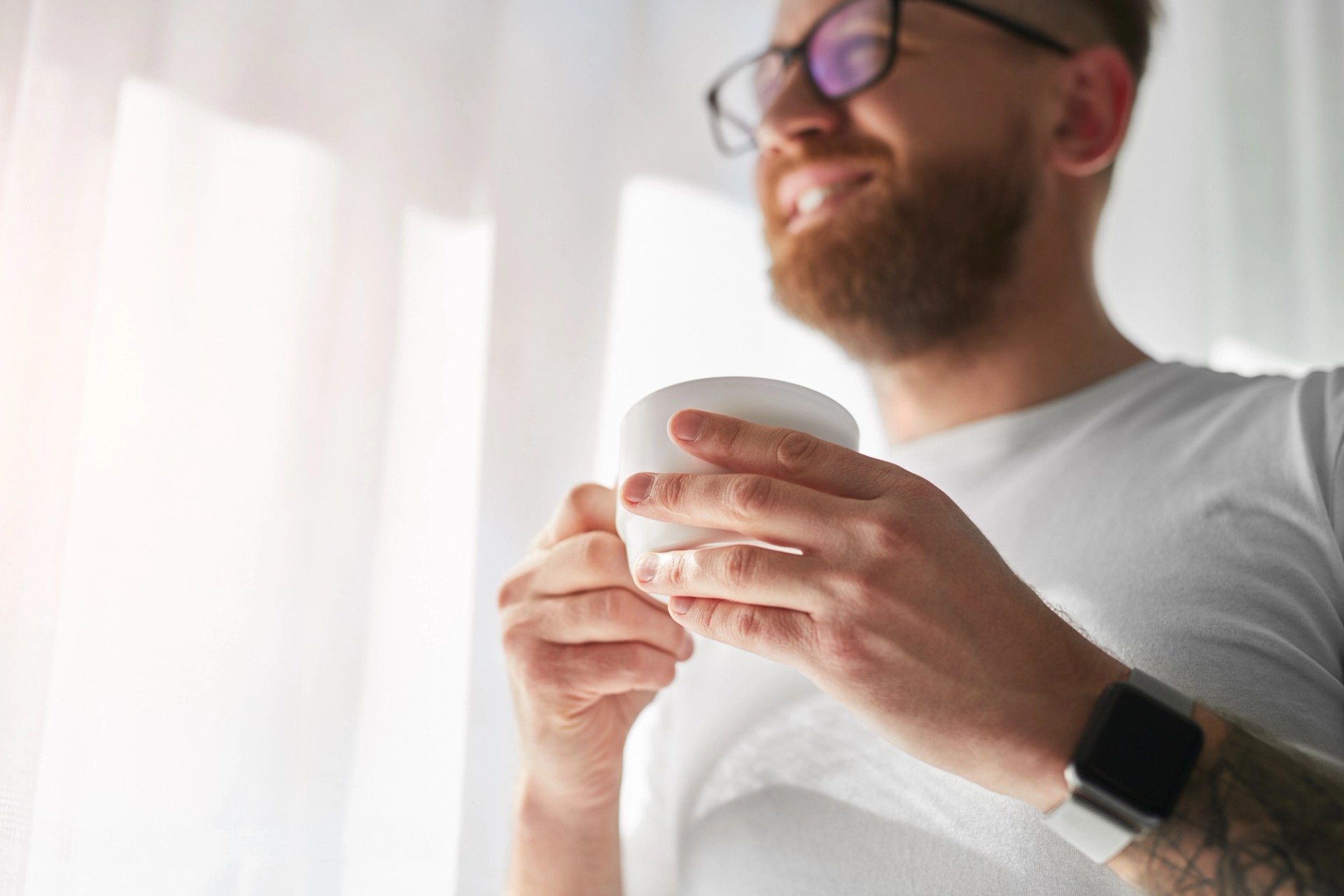 Happy man taking his coffee