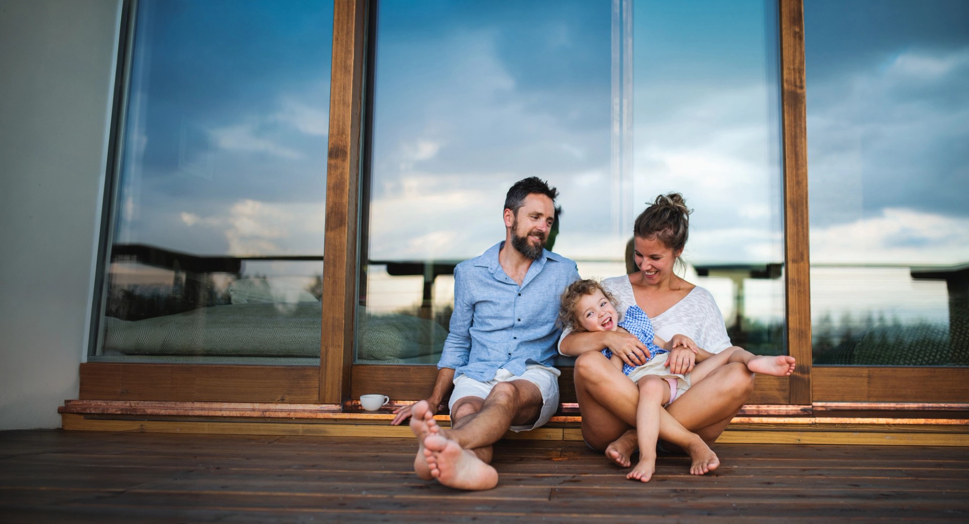 Happy family relaxing on the balcony