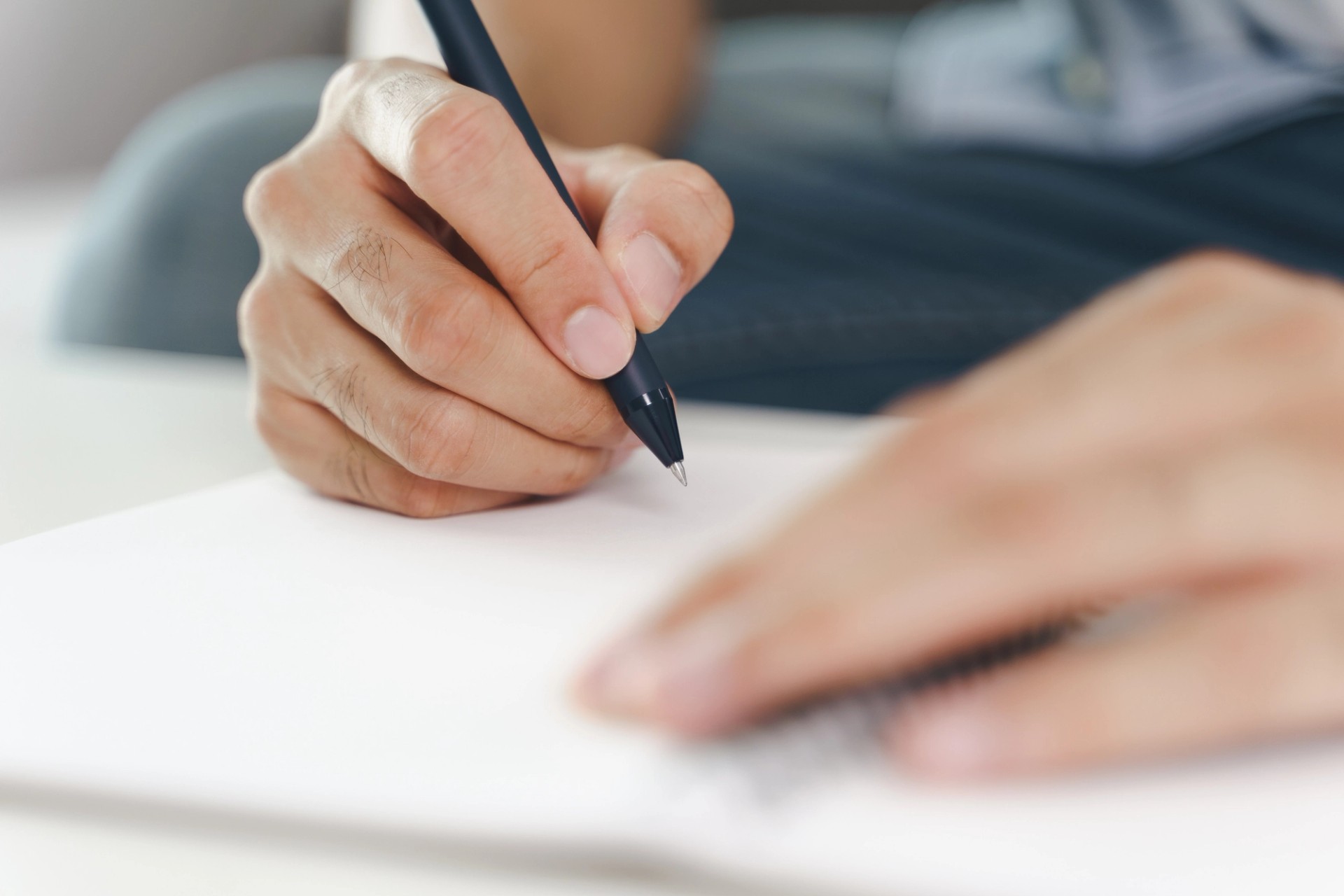 Guy writting something