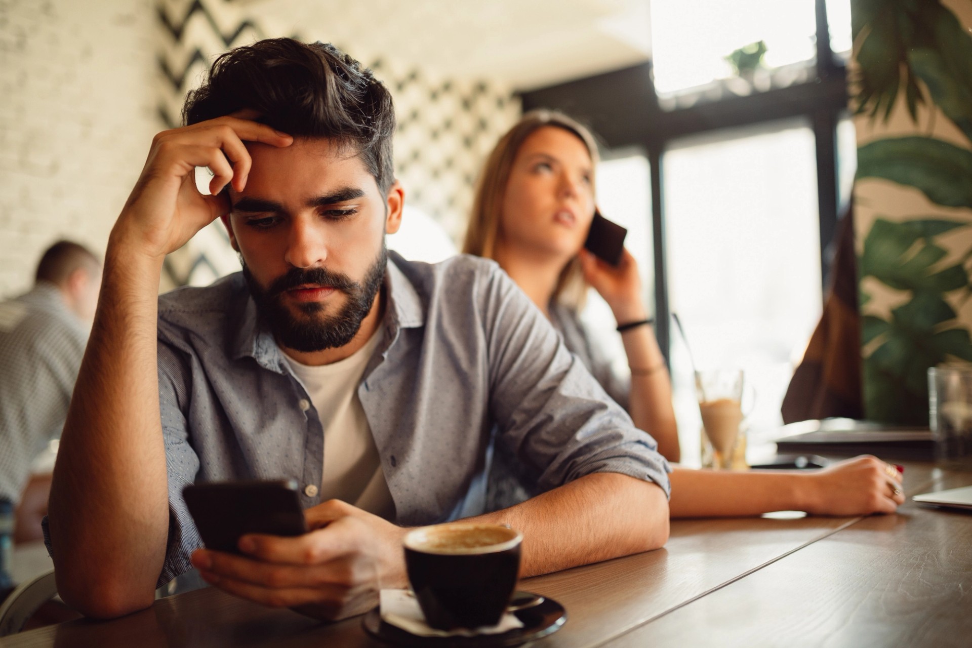 Man looking worried at his phone