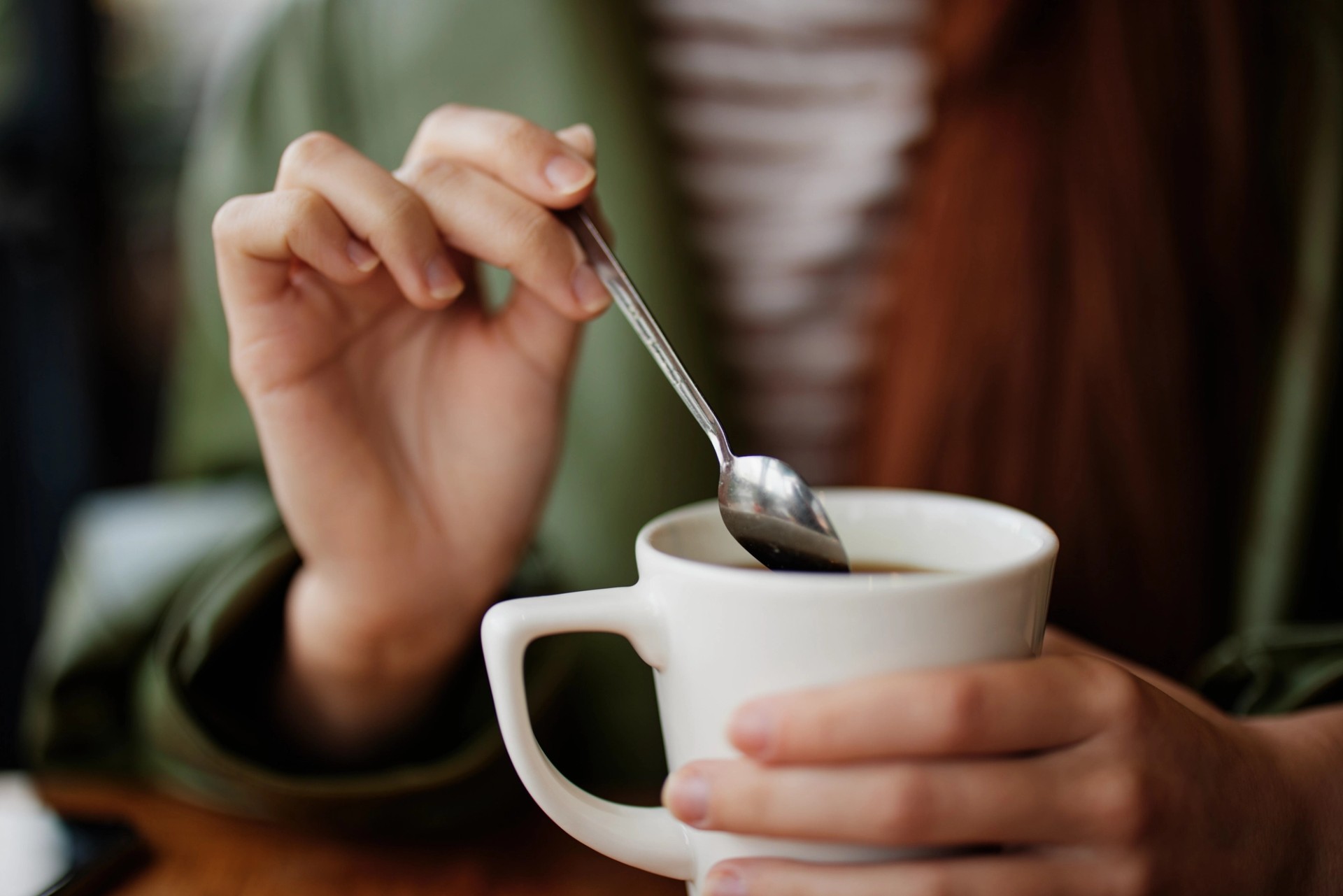 Hand sterring some coffee