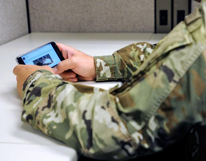 Someone holding a smartphone with a photo