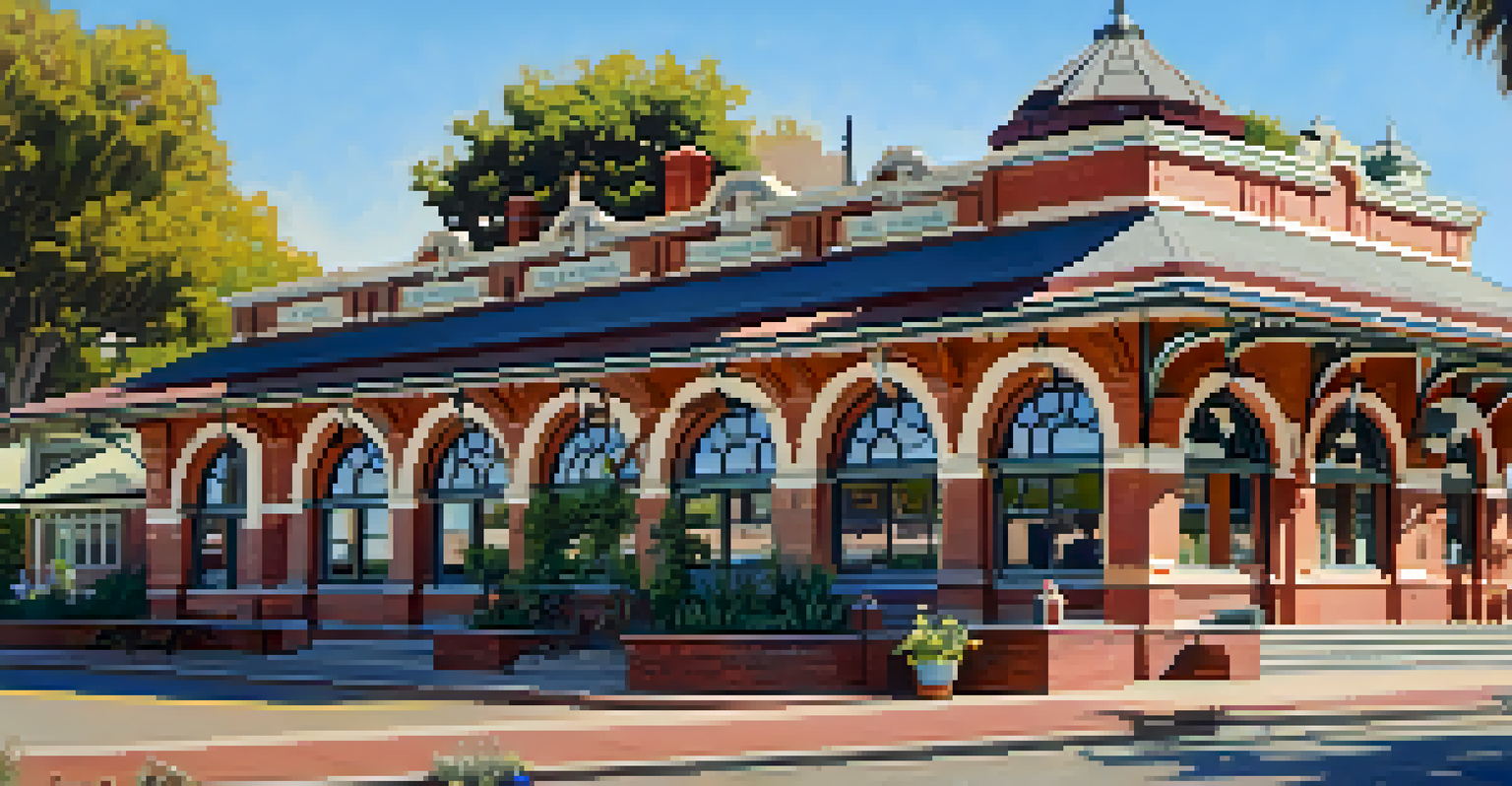 The historic Carlsbad Depot train station with vintage architecture and blooming gardens under a clear sky.