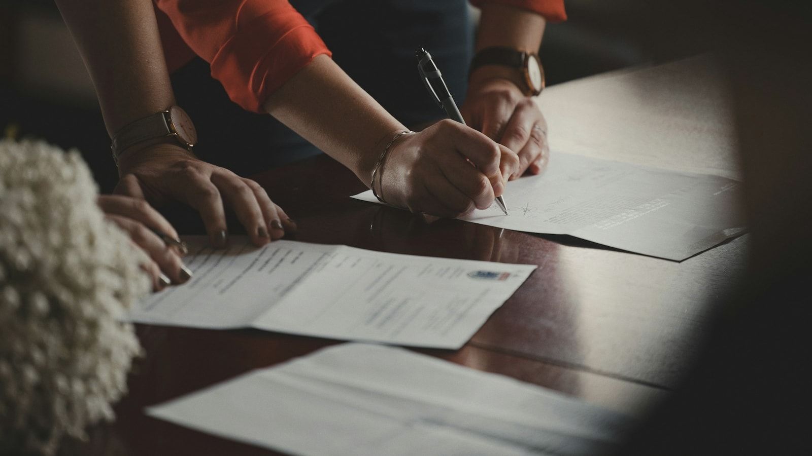 People signing documents for a wedding