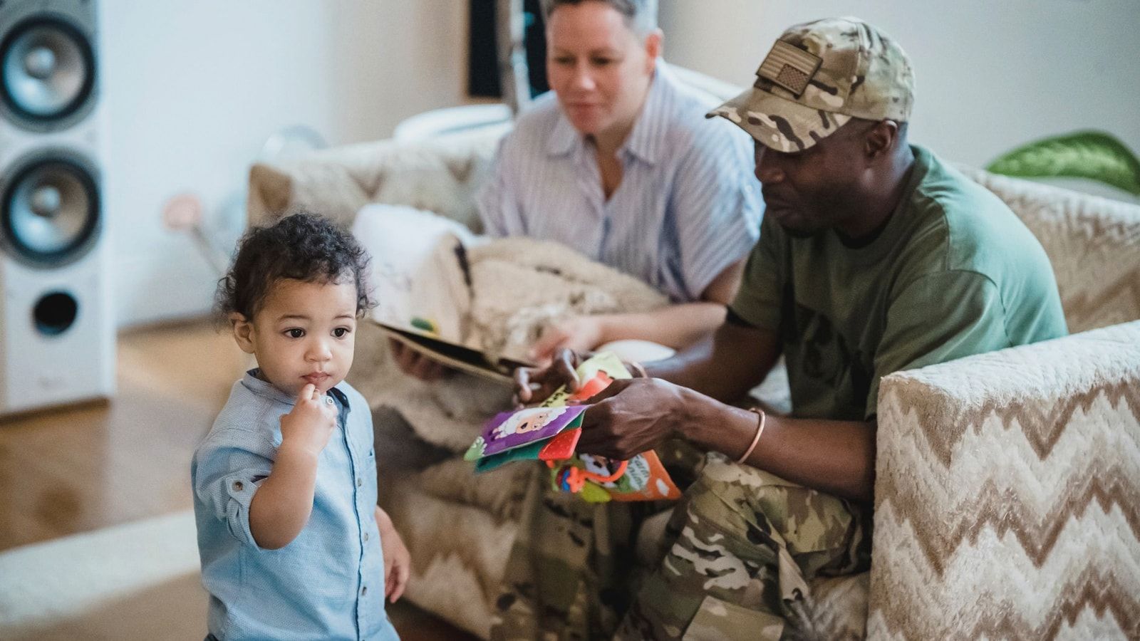 A playful moment at home showing a toddler with parents, capturing family bonding.