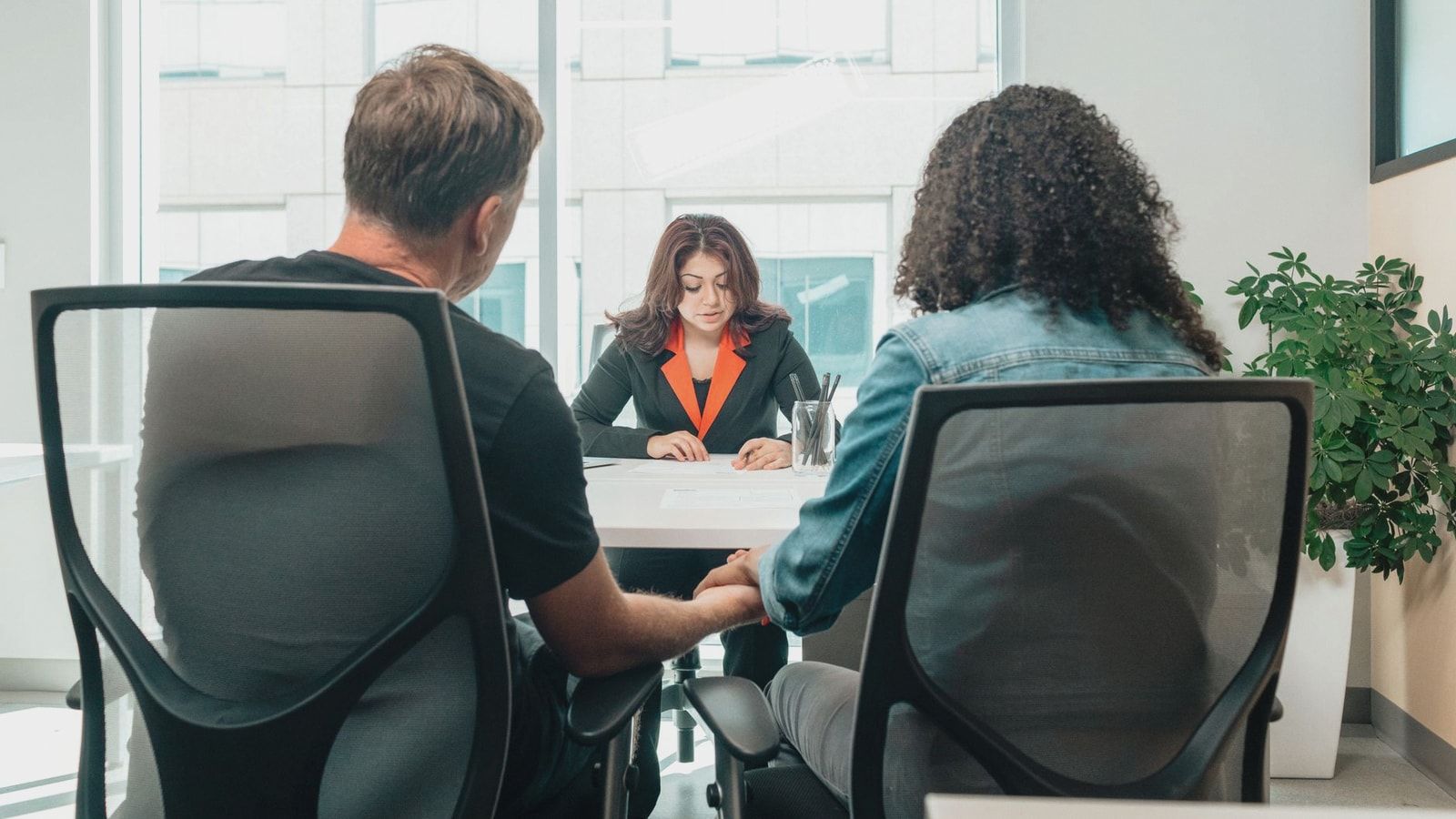 A business consultation in a modern office, depicting collaboration and discussion.