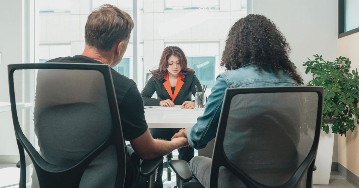 A business consultation in a modern office, depicting collaboration and discussion.