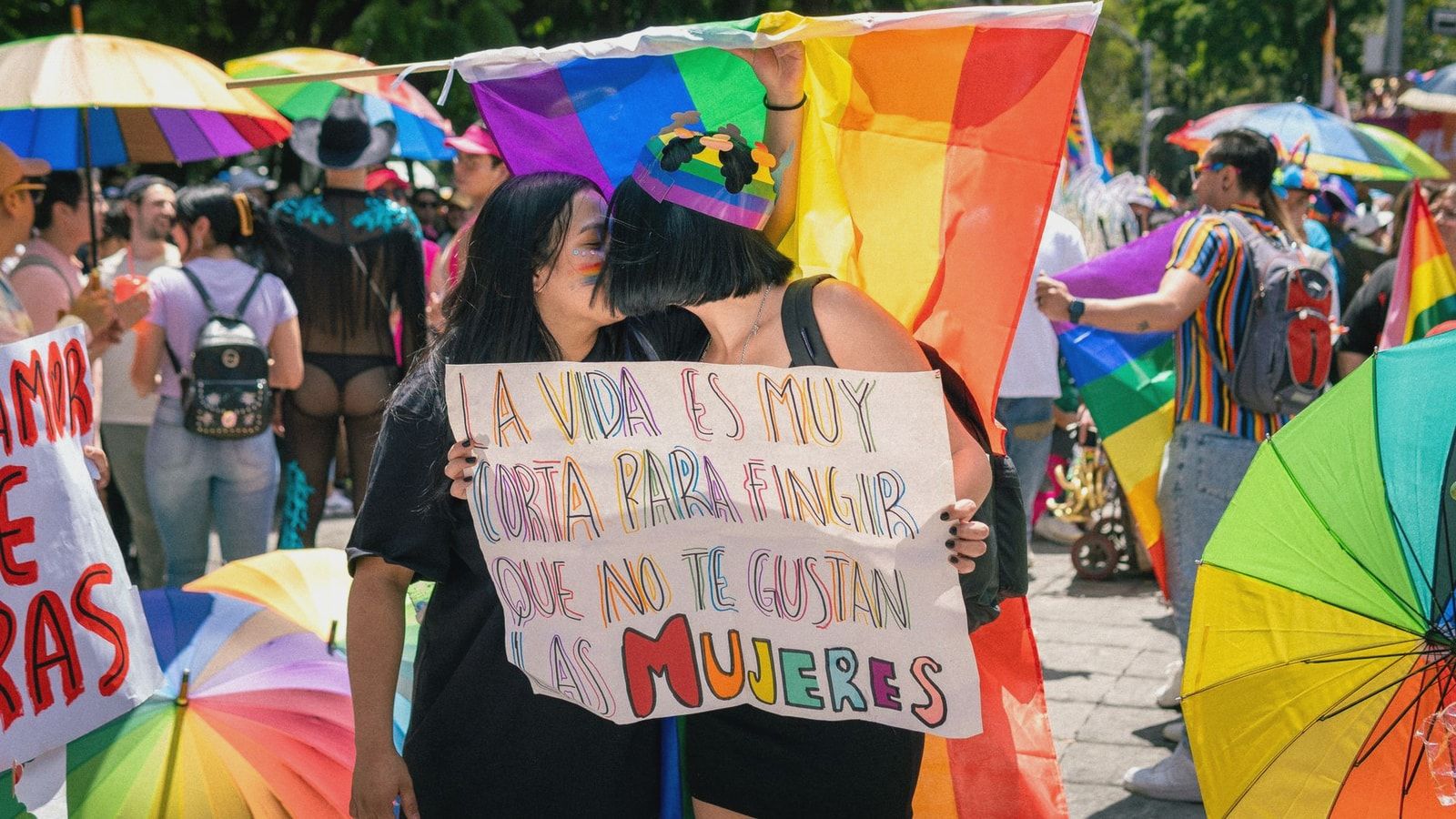 Colorful pride parade capturing joyful moments and LGBTQ+ solidarity in a sunny outdoor setting.