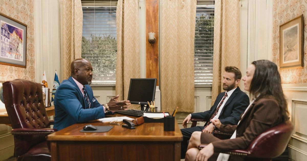 Lawyers discussing with a client in a professional office environment. Business meeting concept.