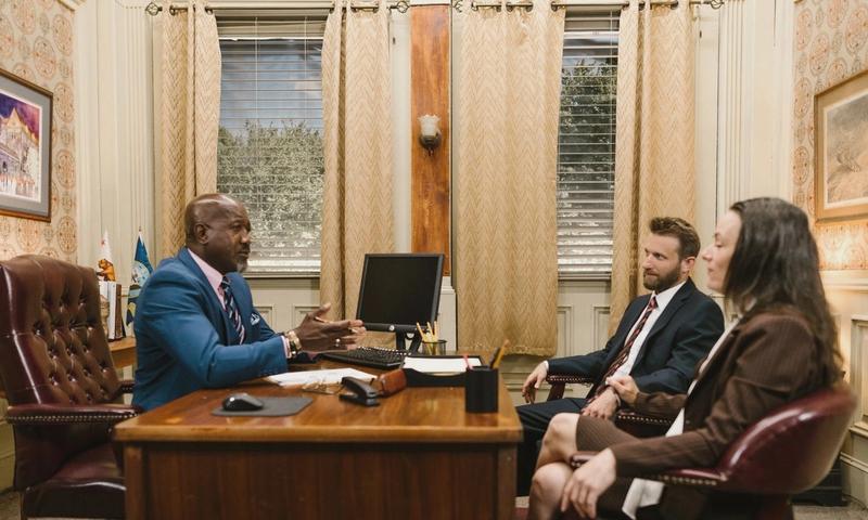 Lawyers discussing with a client in a professional office environment. Business meeting concept.