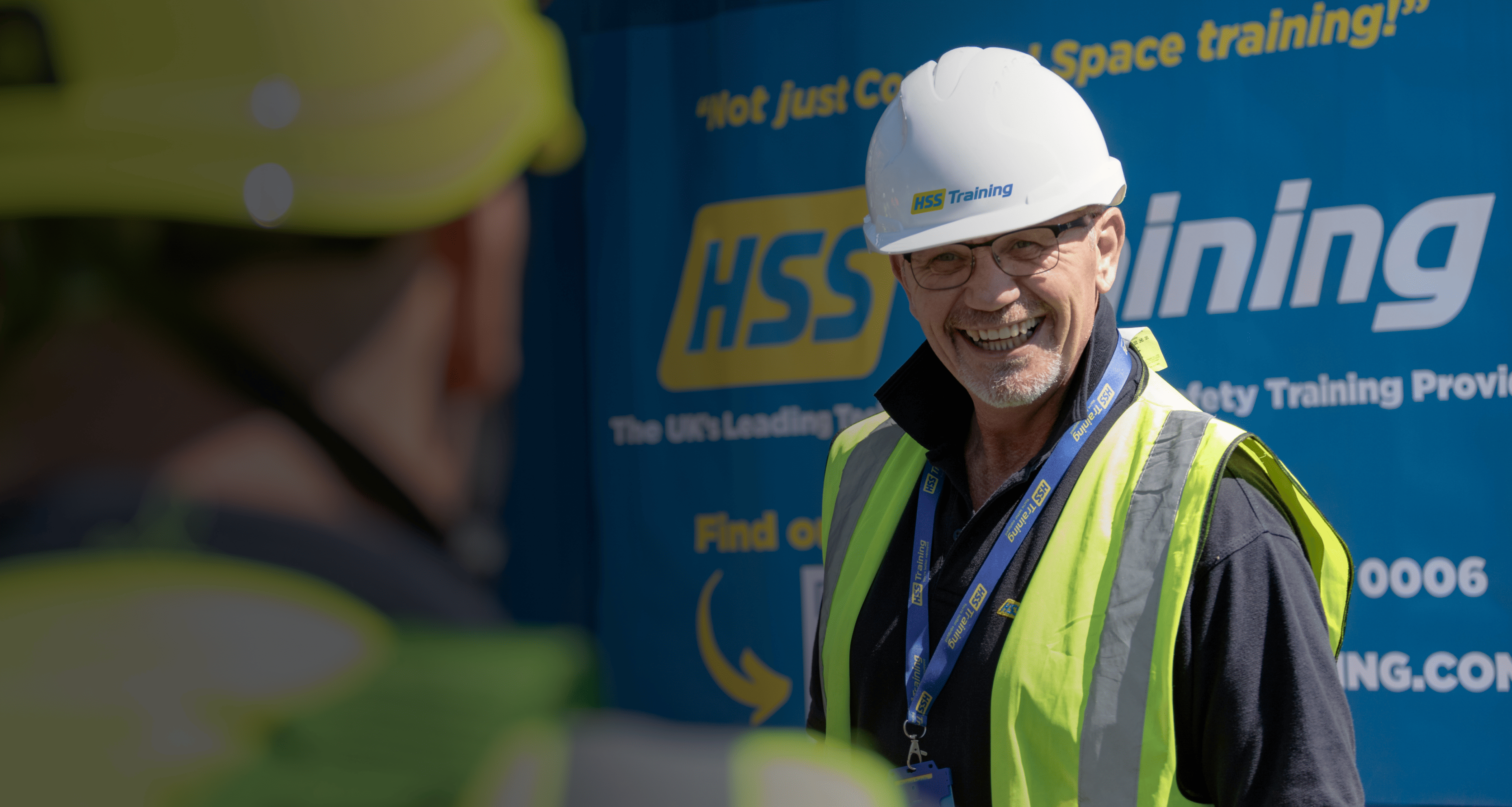 man with helmet smiling