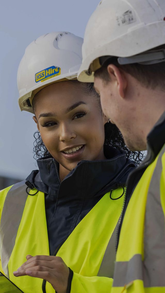 man and woman on construction site