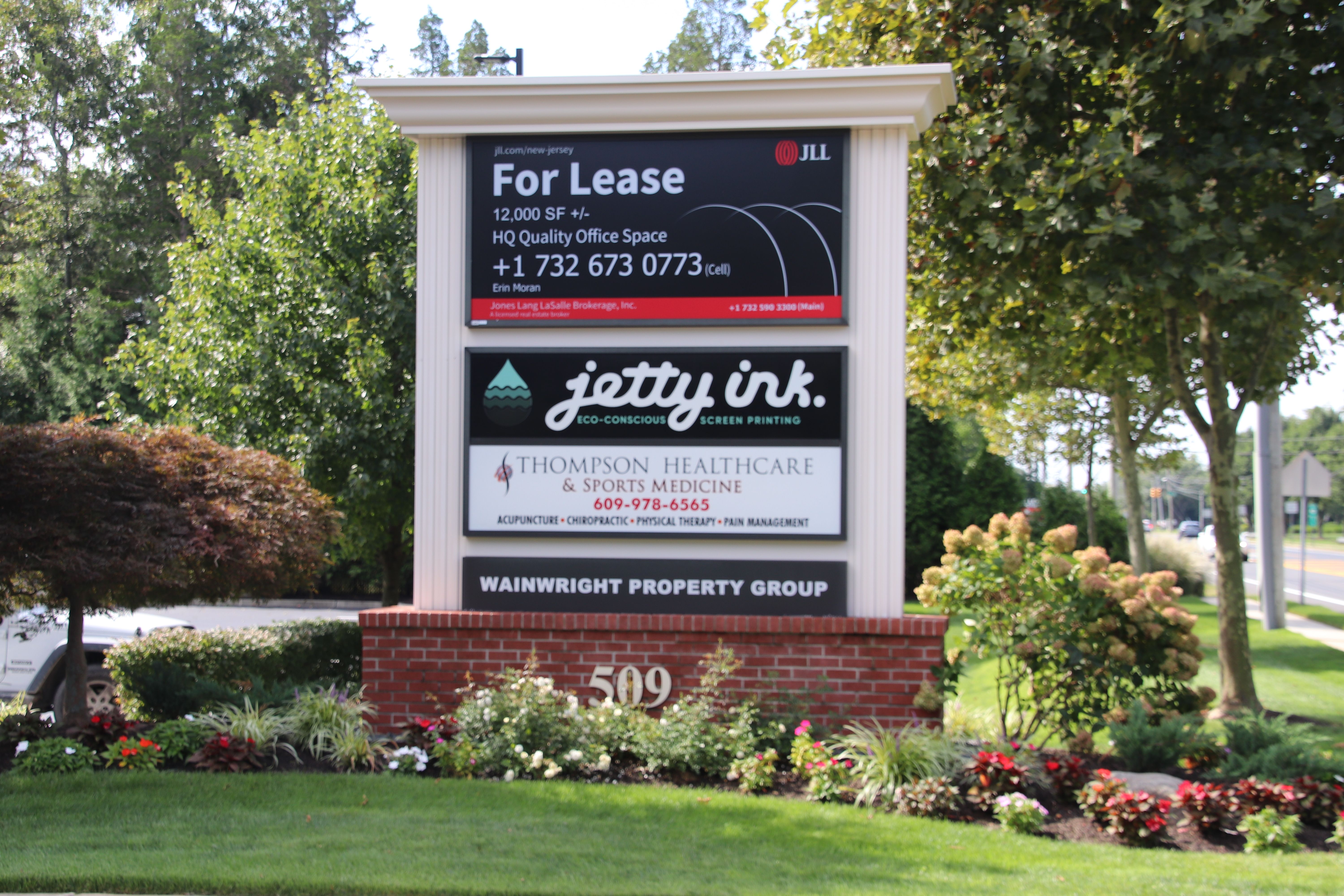 Directory sign on Route 9, located in front of the Thompson Healthcare & Sports Medicine - Manahawkin location.