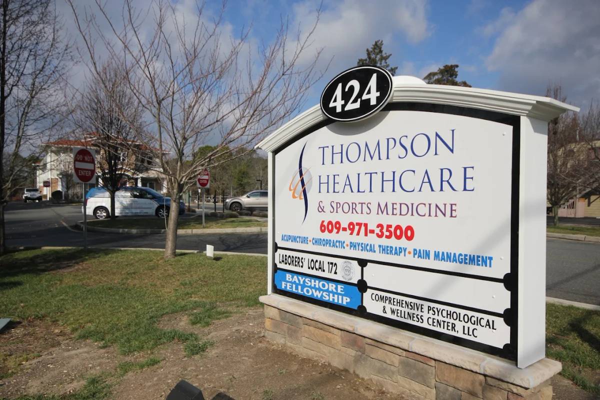 Sign on Main Street in front of the Lacey location of Thompson Healthcare & Sports Medicine.
