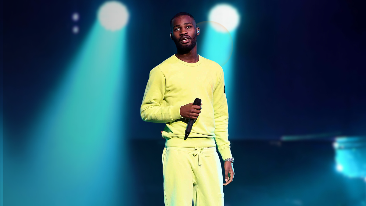 Dave performing live on stage at a music concert
