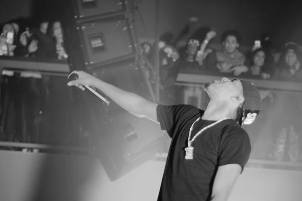 J. Cole performing on the What Dreams May Come Tour in January 2014