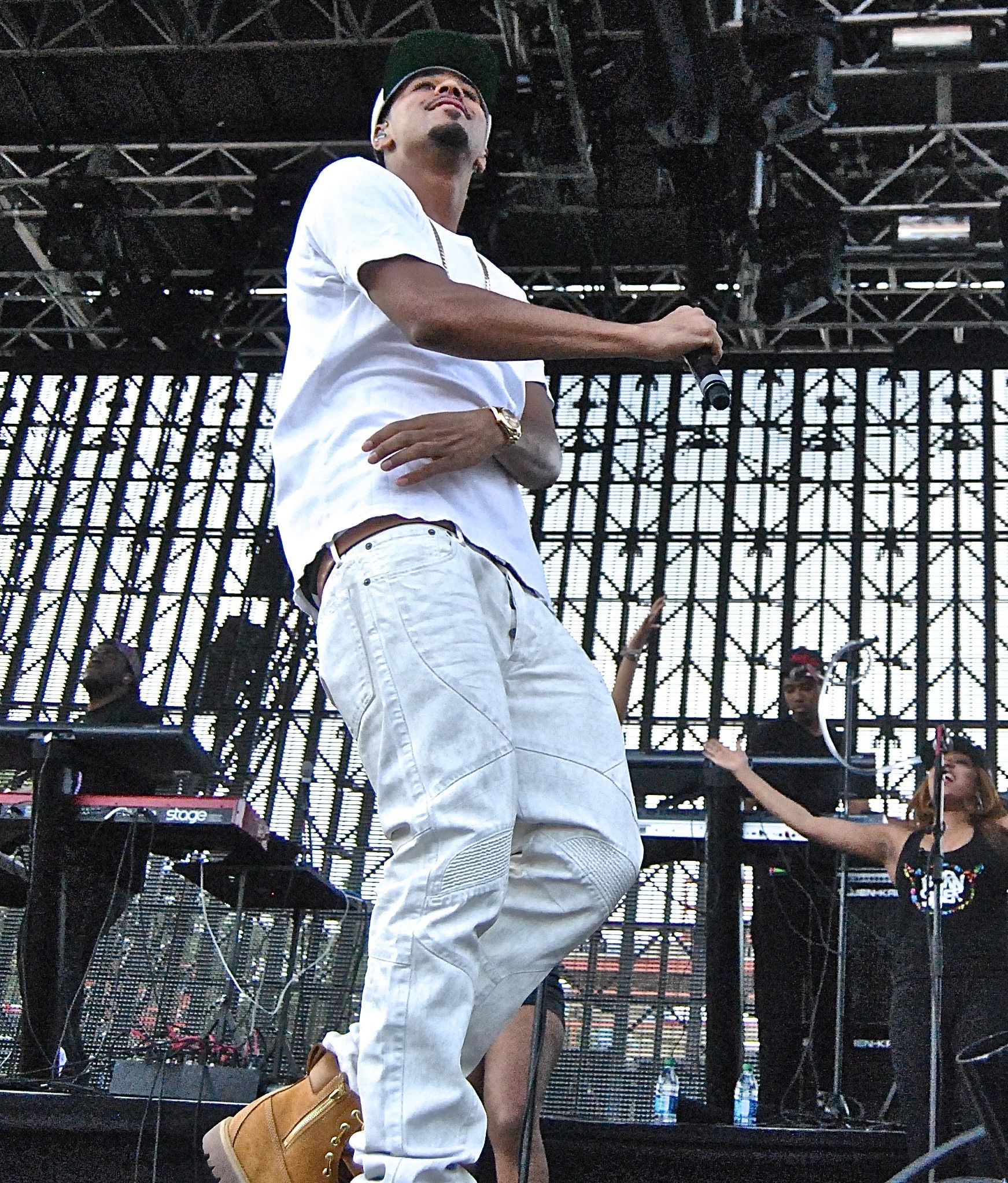 J. Cole performing on stage at Governors Ball in New York in June 2014