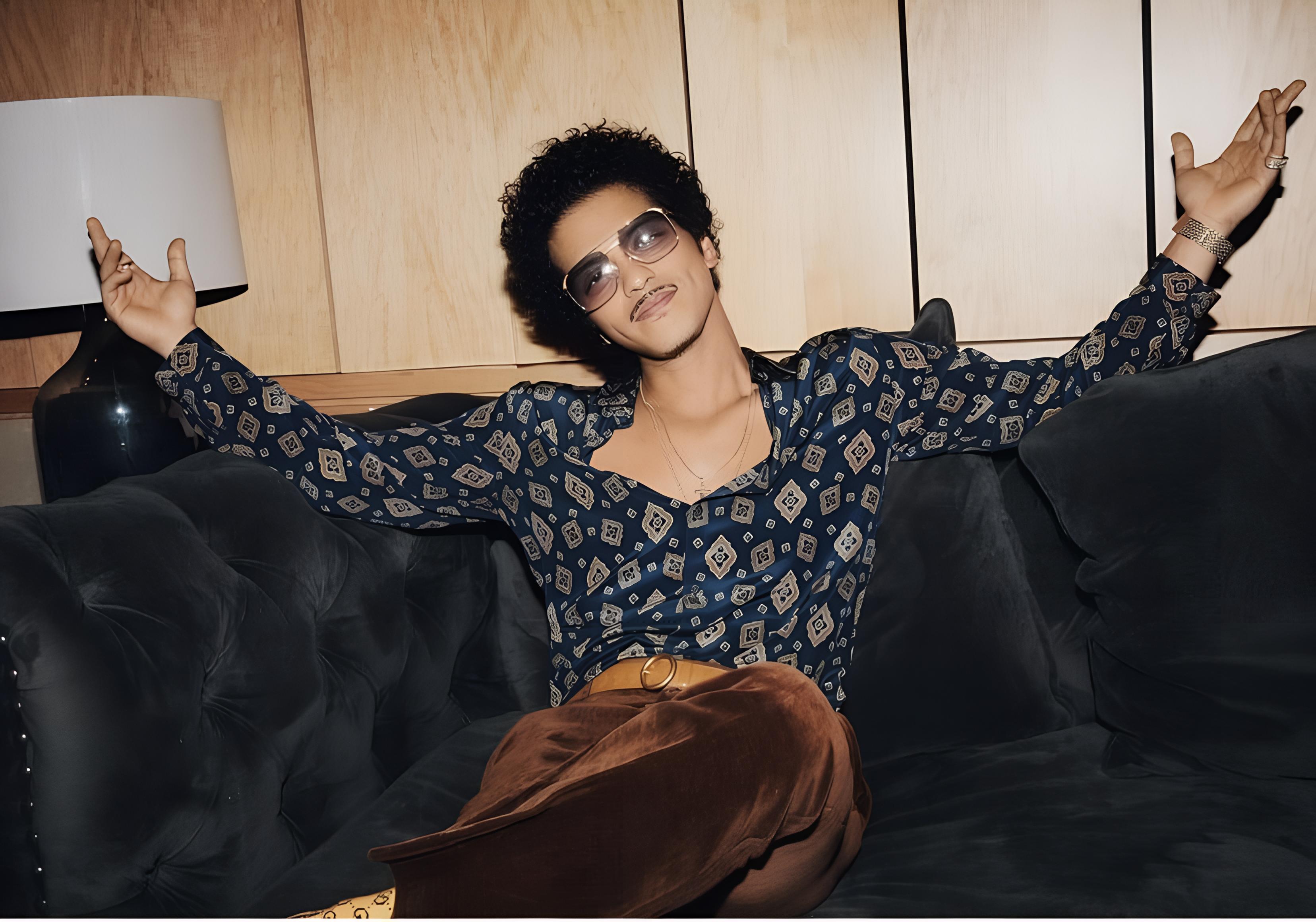 Bruno Mars, in retro attire, relaxes on a velvet sofa within a vintage wood-paneled lounge.