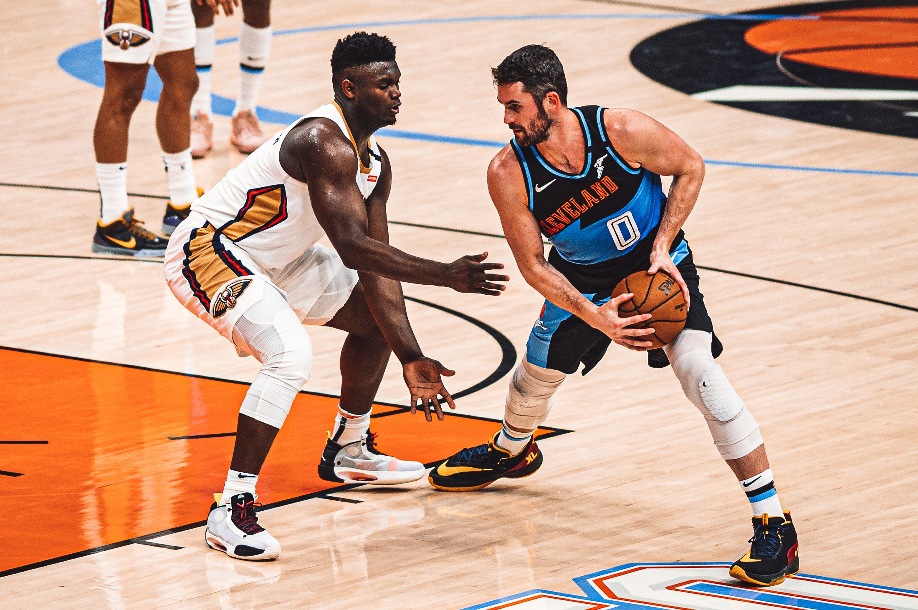 Zion Williamson of the New Orleans Pelicans guarding Kevin Love of Cleveland on court in January 2020