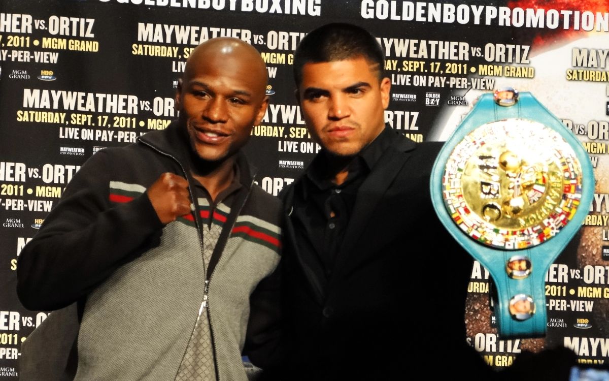 Floyd Mayweather Jr. and Victor Ortiz face each other at a press conference in June 2011