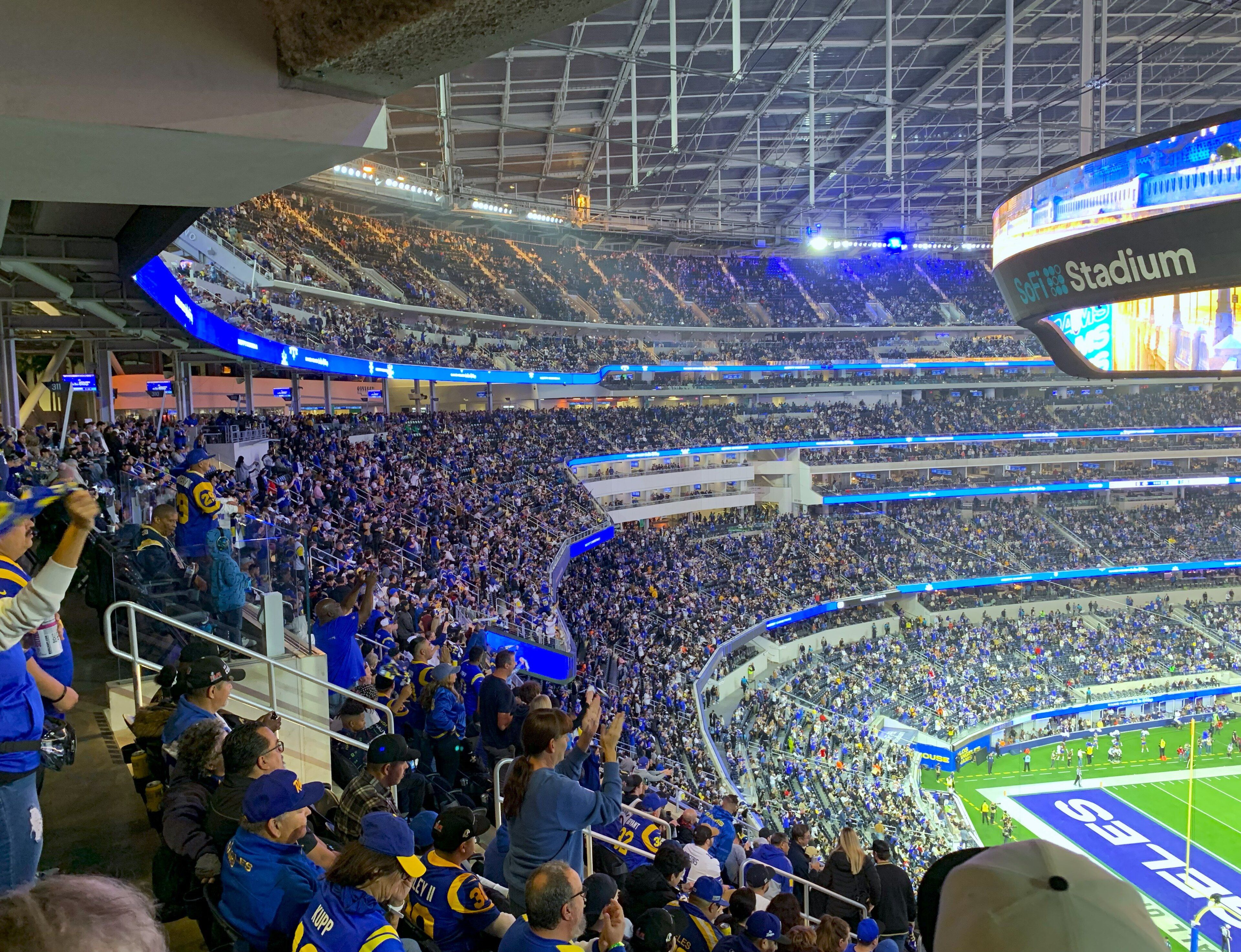 Los Angeles Rams fans filling the stands at SoFi Stadium during a home game against the New Orleans Saints in December 2023