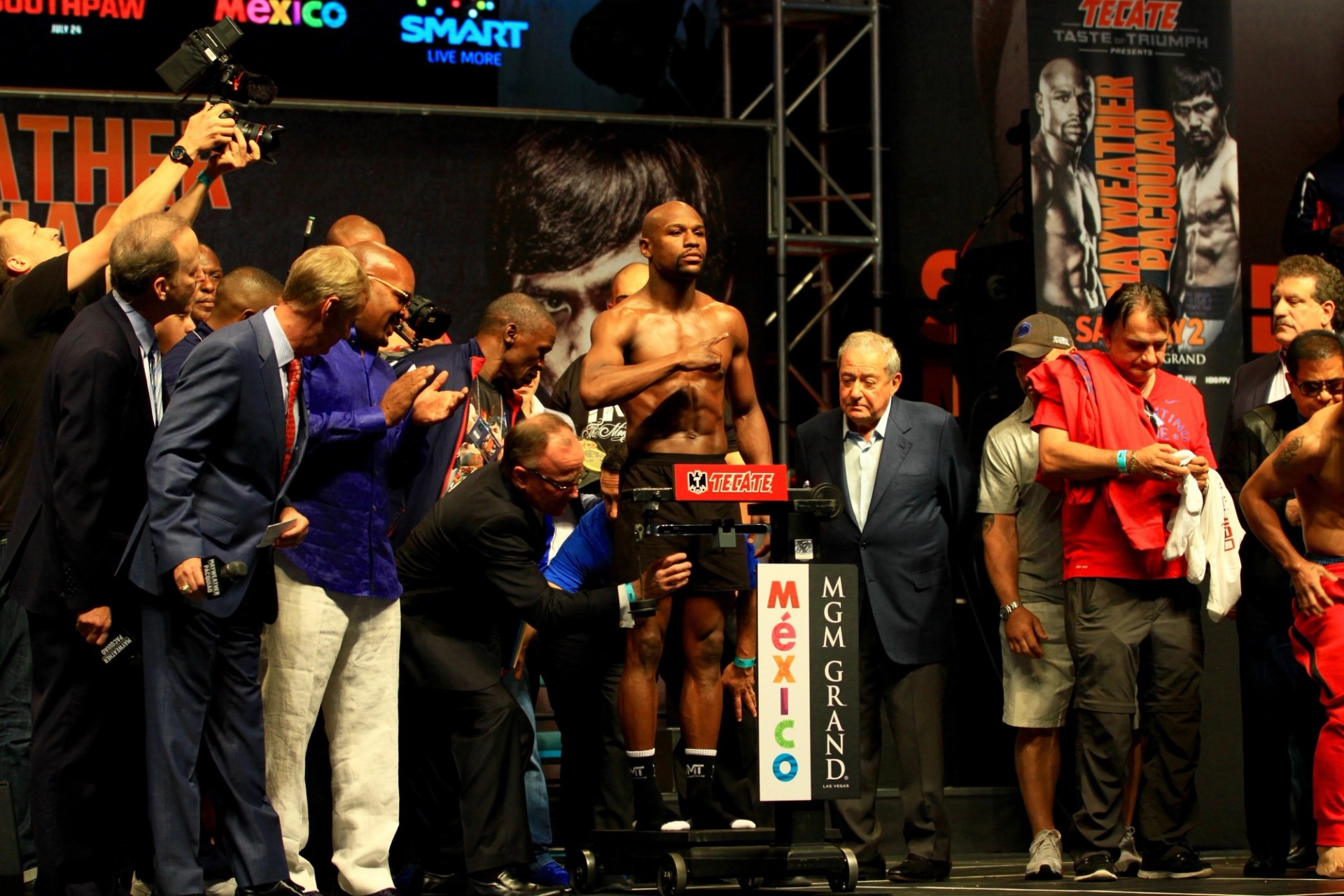 Floyd Mayweather Jr. on stage at a boxing weigh-in in 2015