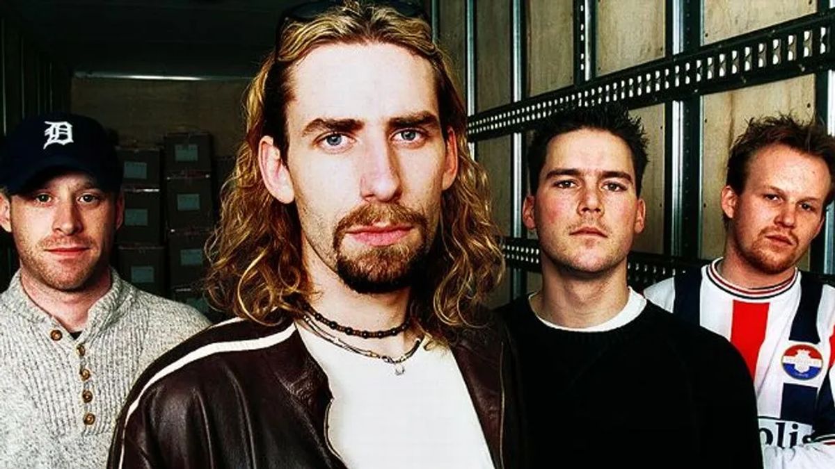 An older Nickelback band photo, Chad Kroeger with long hair and a brown leather jacket at the front