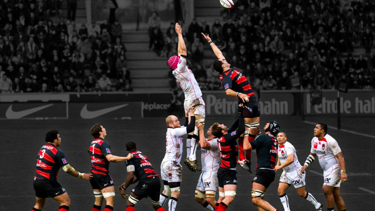 Dynamic rugby union lineout: RC Toulon vs Clermont, players leaping for Gilbert ball.