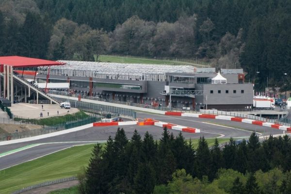 Open air grandstand seating and a giant screen overlooking the track at Circuit de Spa-Francorchamps