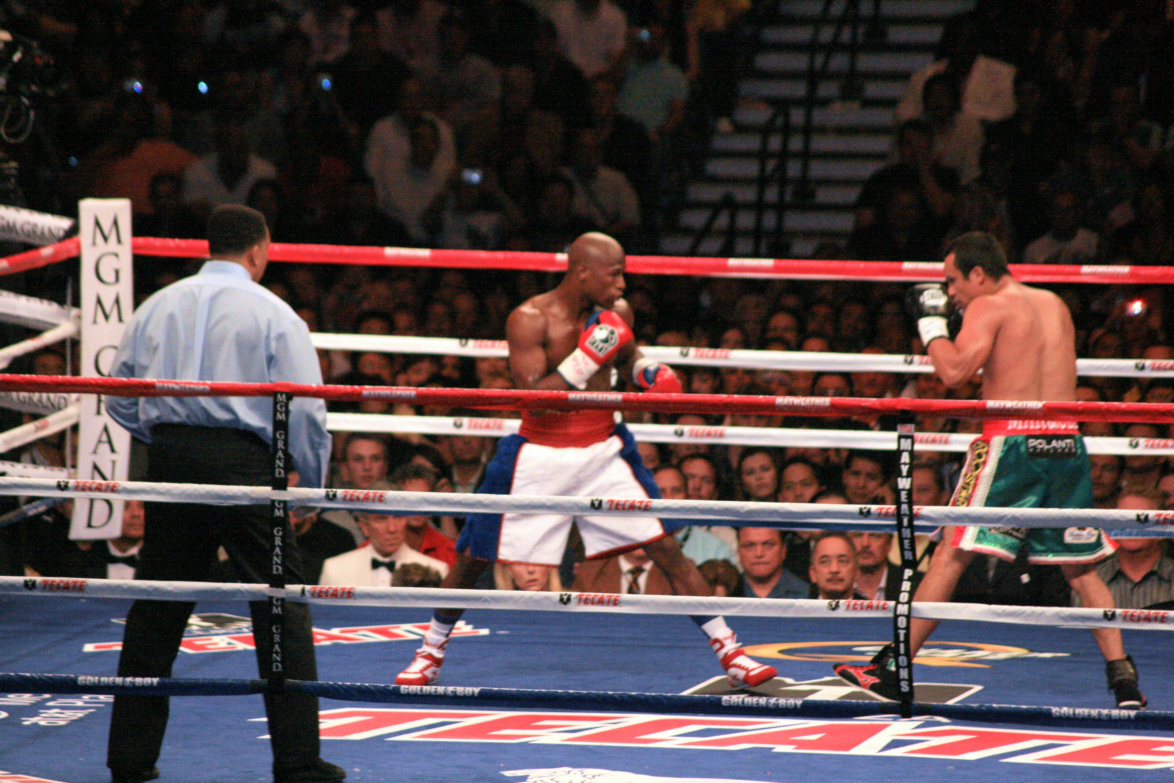 Floyd Mayweather Jr. boxing Juan Manuel Márquez in the ring at the MGM Grand Garden Arena in 2009