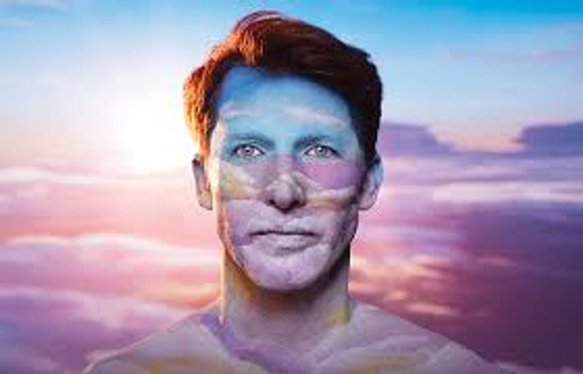 Artwork of James Blunt with clouds and sky colours painted across his face, set against a pink and blue sky