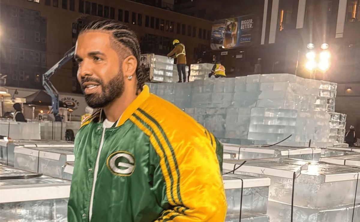 Drake in Packers jacket at ice event setup
