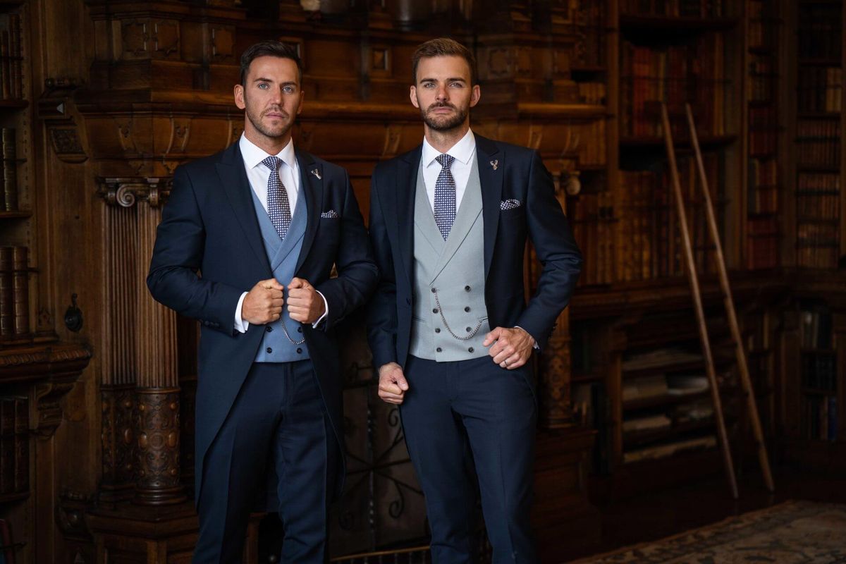 Two well-dressed men in luxury formal library ascot dress code