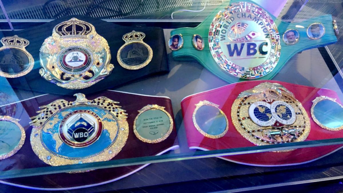 Oleksandr Usyk's world cruiserweight title belts laid out on display at media workouts before his fight with Tony Bellew