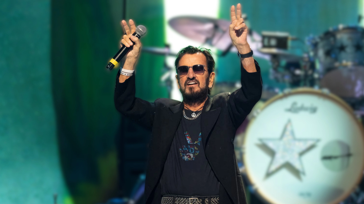 Ringo Starr performs live, peace & love gesture